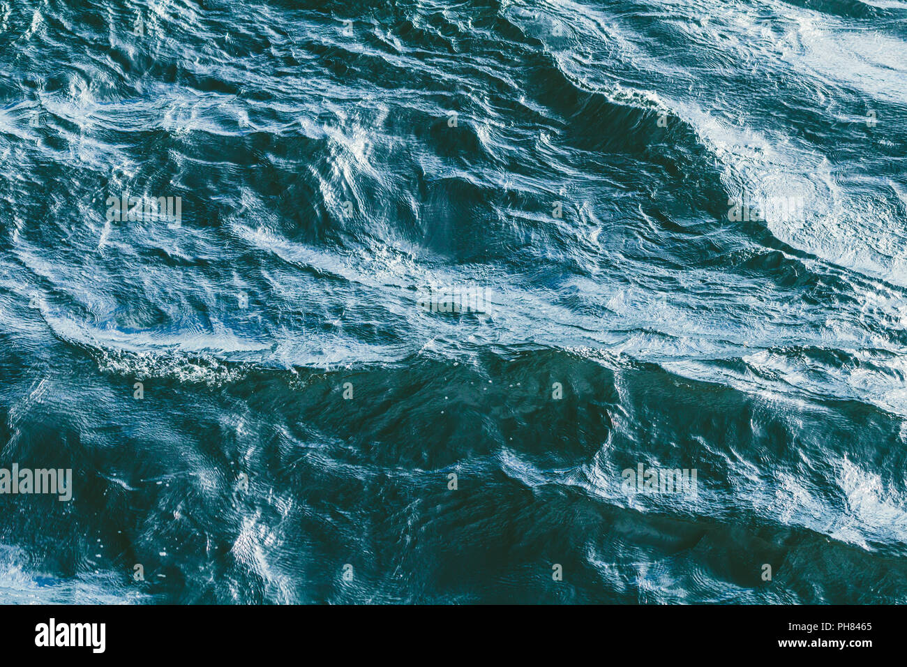 Top view of stormy sea. Blue water backround. Stock Photo