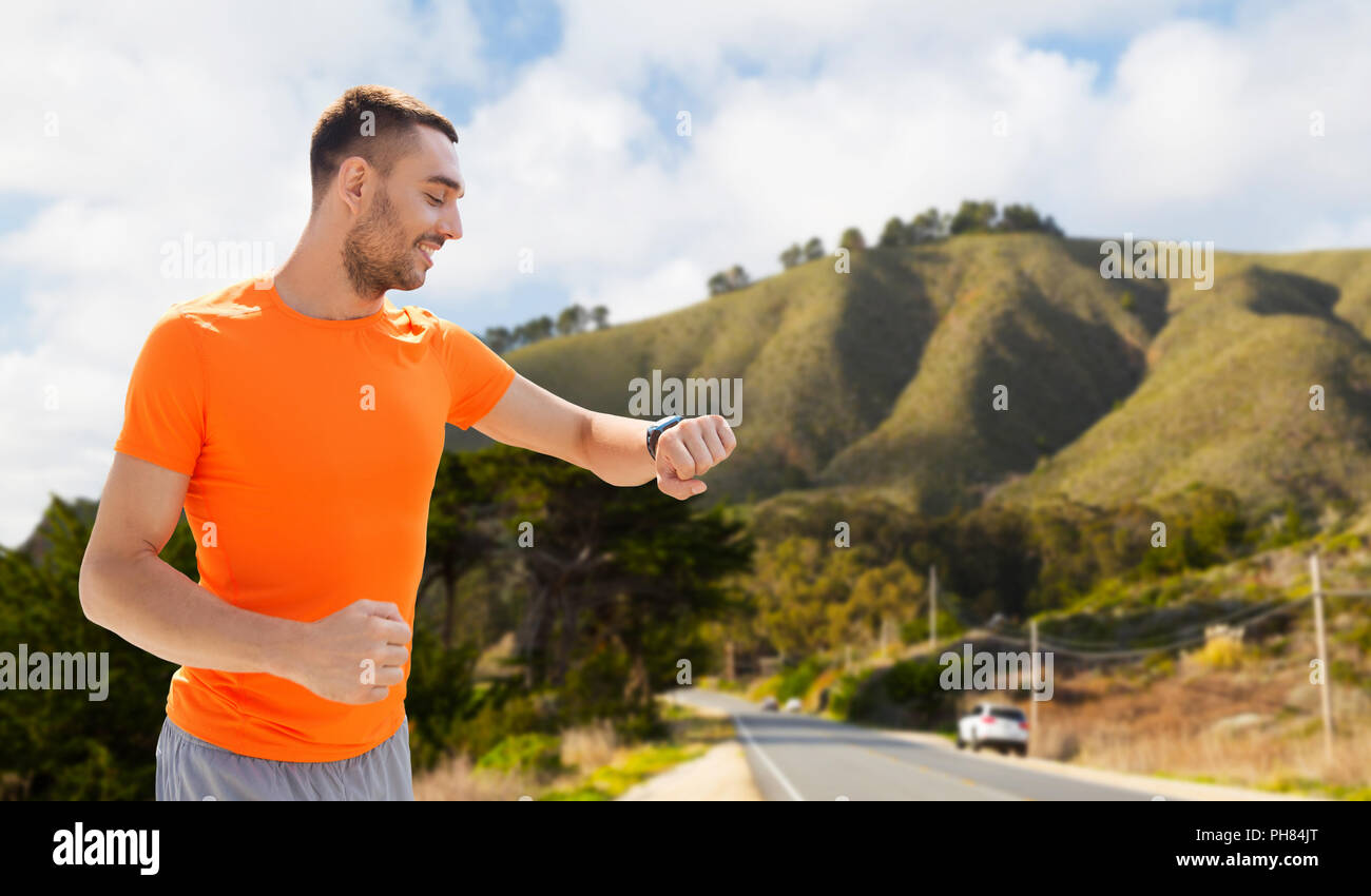 man with smart watch or fitness tracker Stock Photo