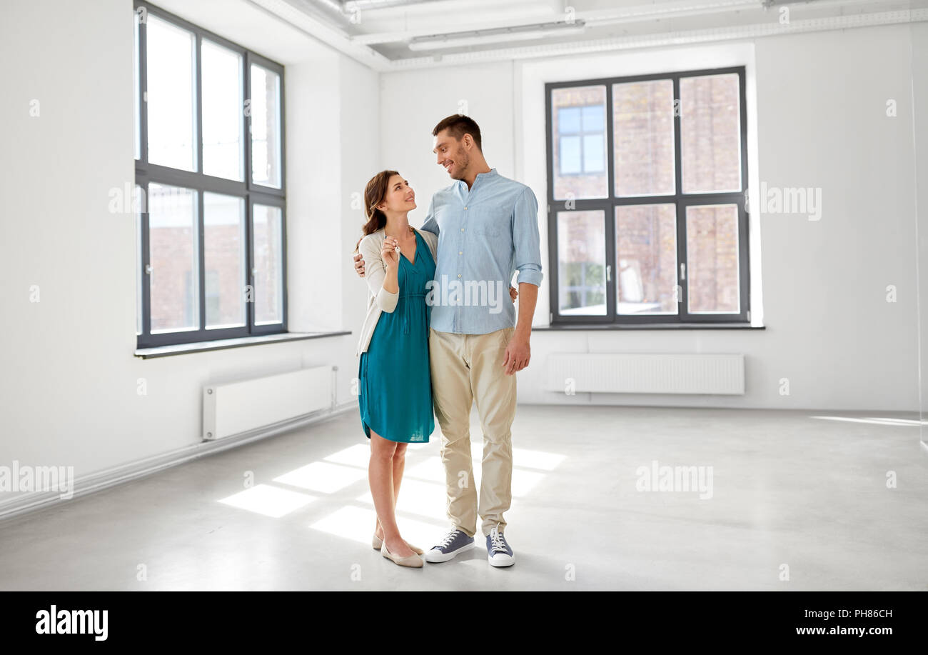happy couple with keys of new home Stock Photo - Alamy