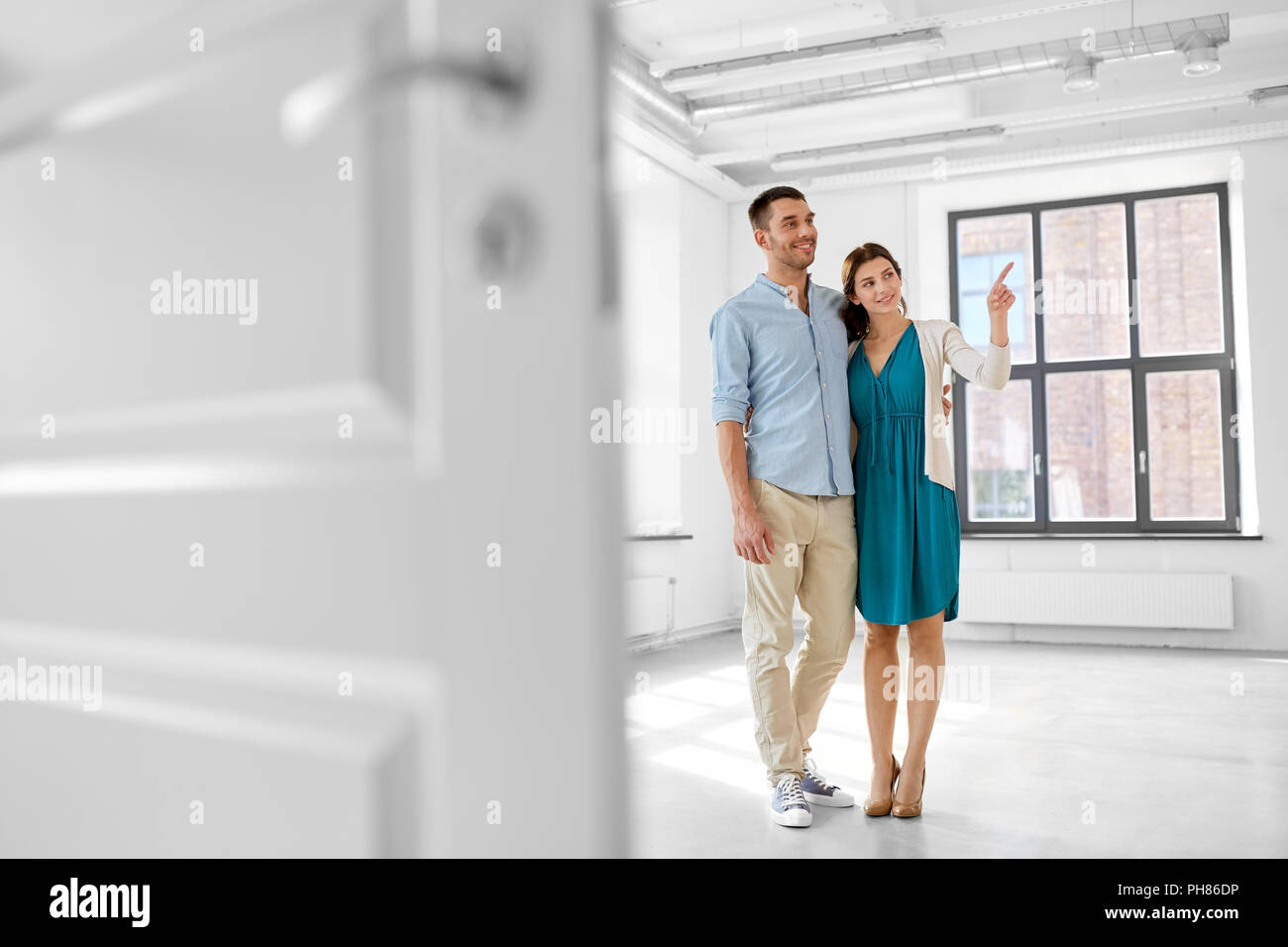 happy couple hugging at new home Stock Photo - Alamy