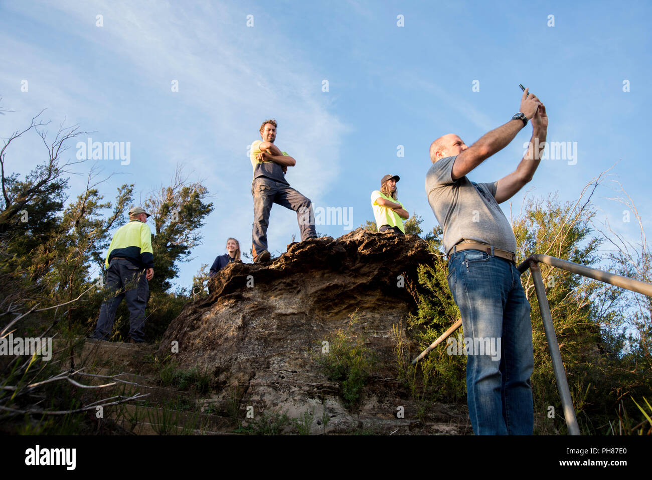 People viewing fire hazard reduction at Mount Solitary, Blue Mountains, Australia Stock Photo