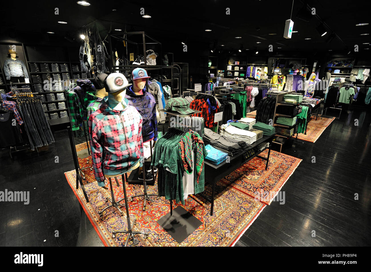 Men's clothing is displayed H&M Hennes & Mauritz Japan KK's soon-to-open  flagship store in the Shibuya district of Tokyo, Japan on Wednesday 16 Sept  Stock Photo - Alamy