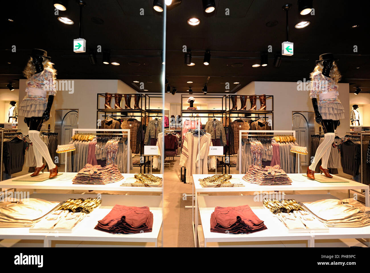 Women's clothing is displayed near the entrance to H&M Hennes & Mauritz  Japan KK's soon-to-open flagship store in the Shibuya district of Tokyo,  Japan Stock Photo - Alamy