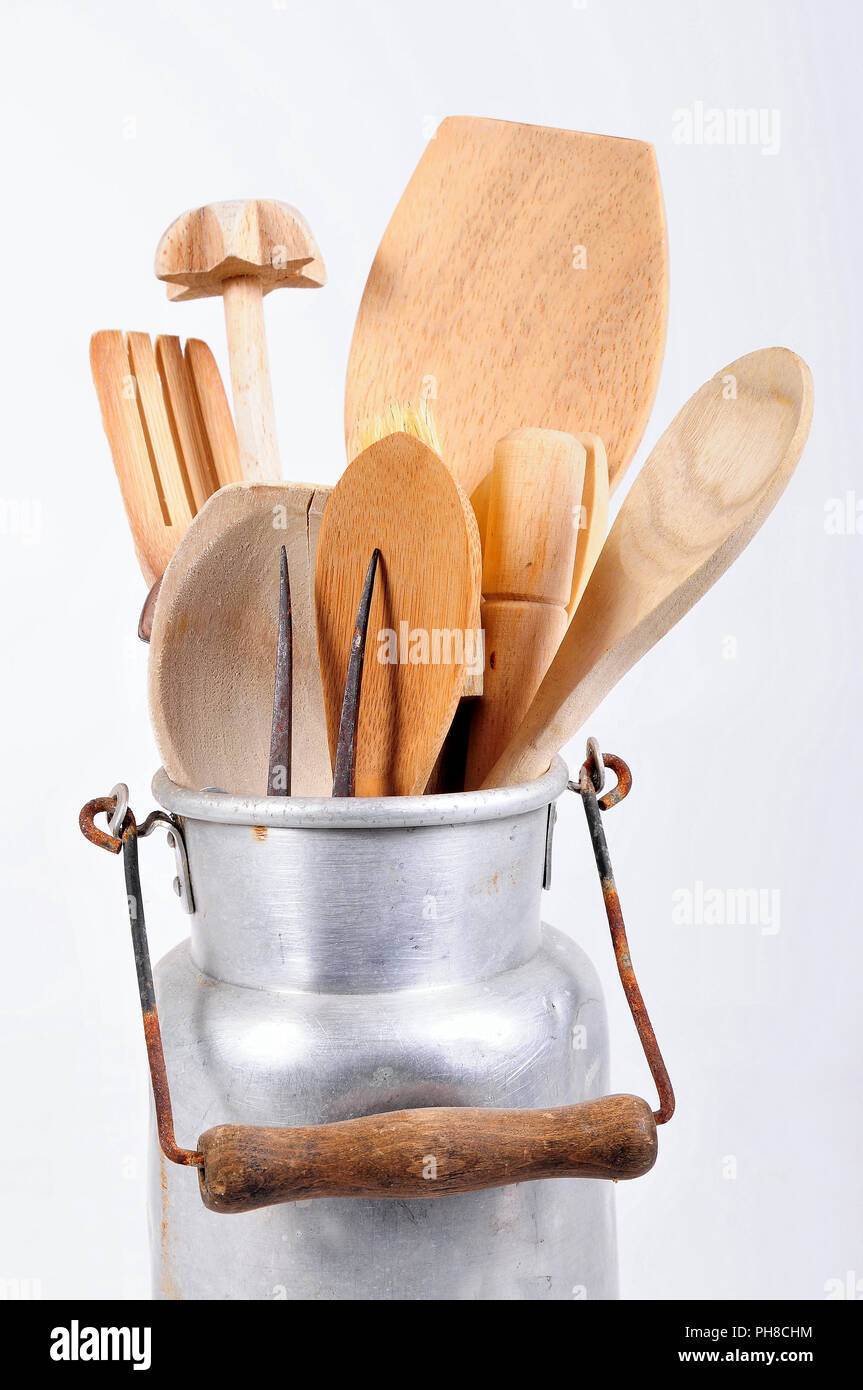 Milk pot with wooden spoon kitchen tool Stock Photo