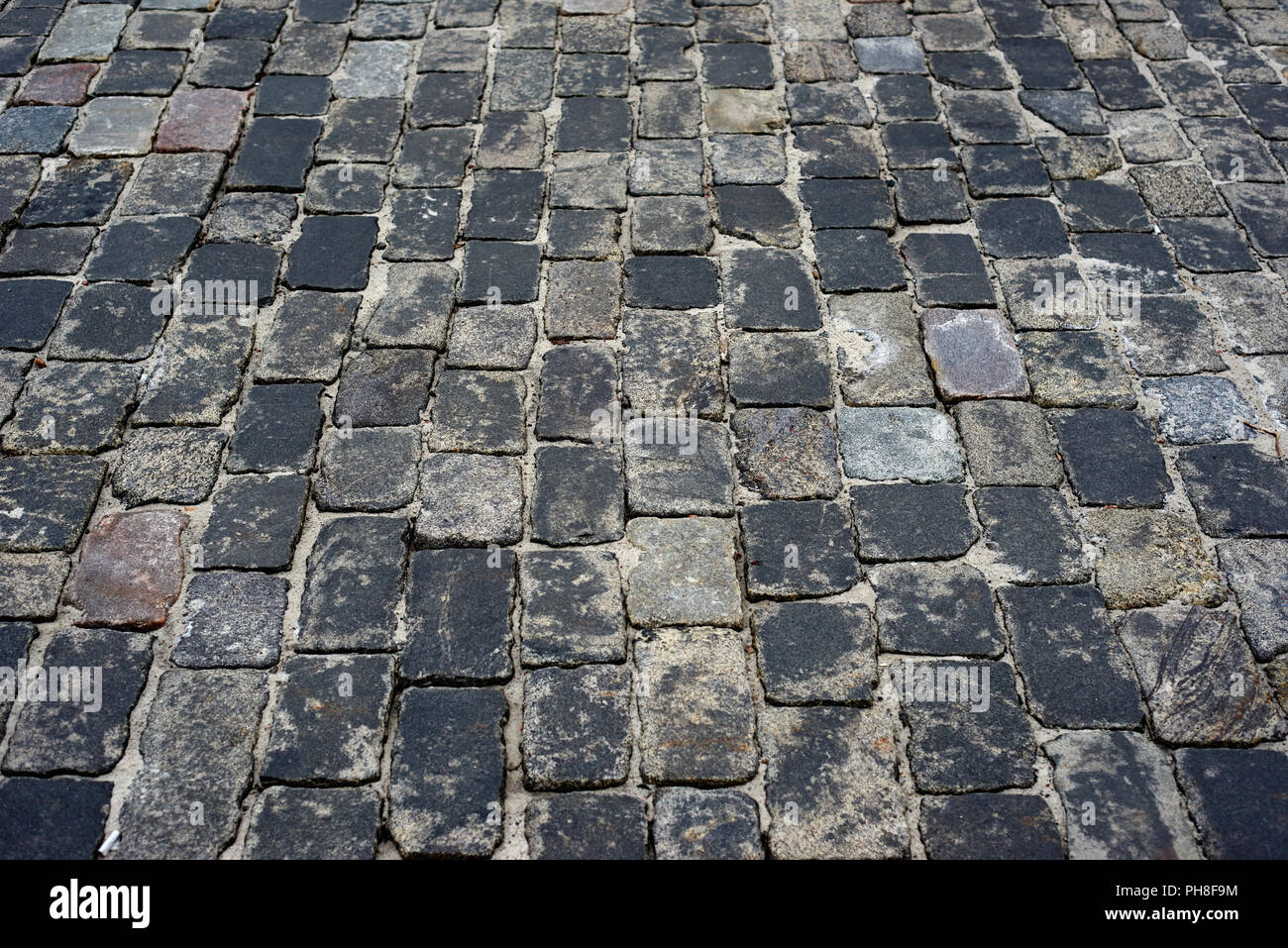 old cobblestone road for background or texture Stock Photo - Alamy