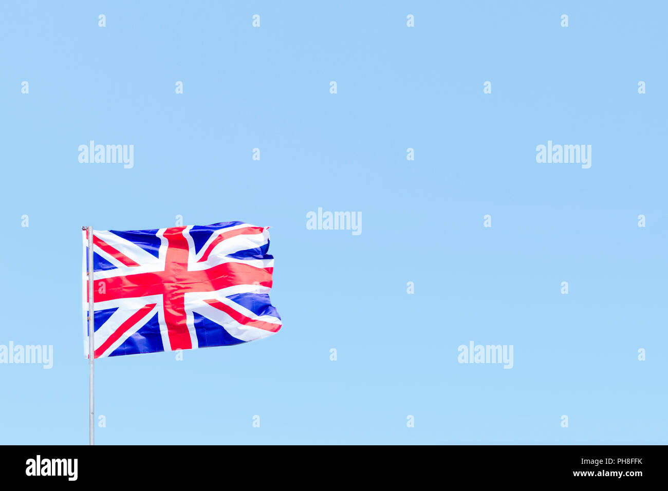 Union Jack flag of Great Britain UK Blowing in the wind against a empty ...