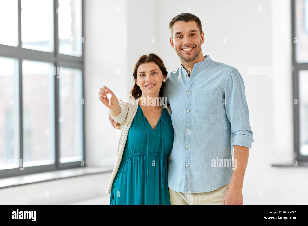 happy couple with keys of new home Stock Photo