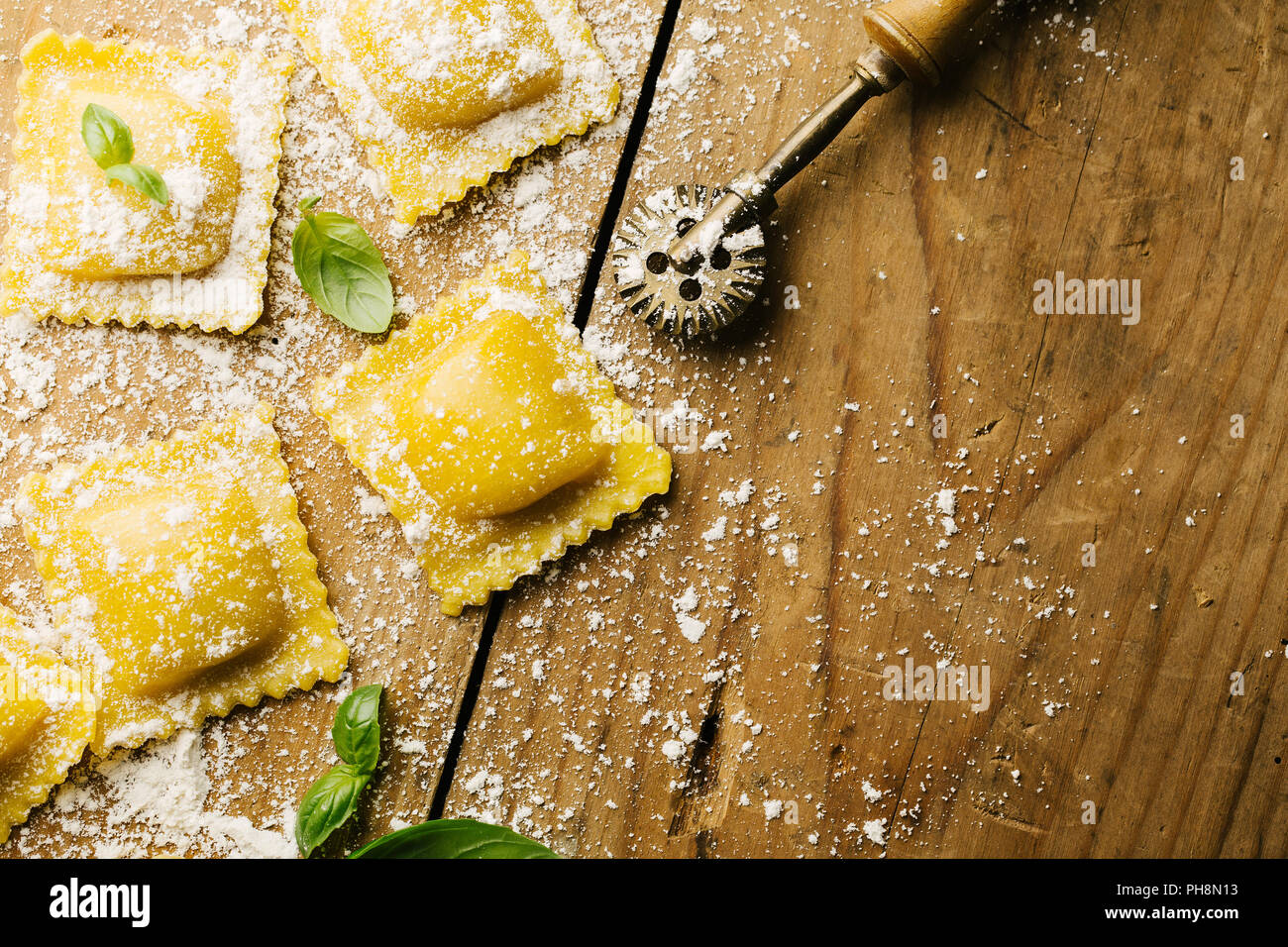 Process of cooking italian ravioli on wooden table. Cooking process ...