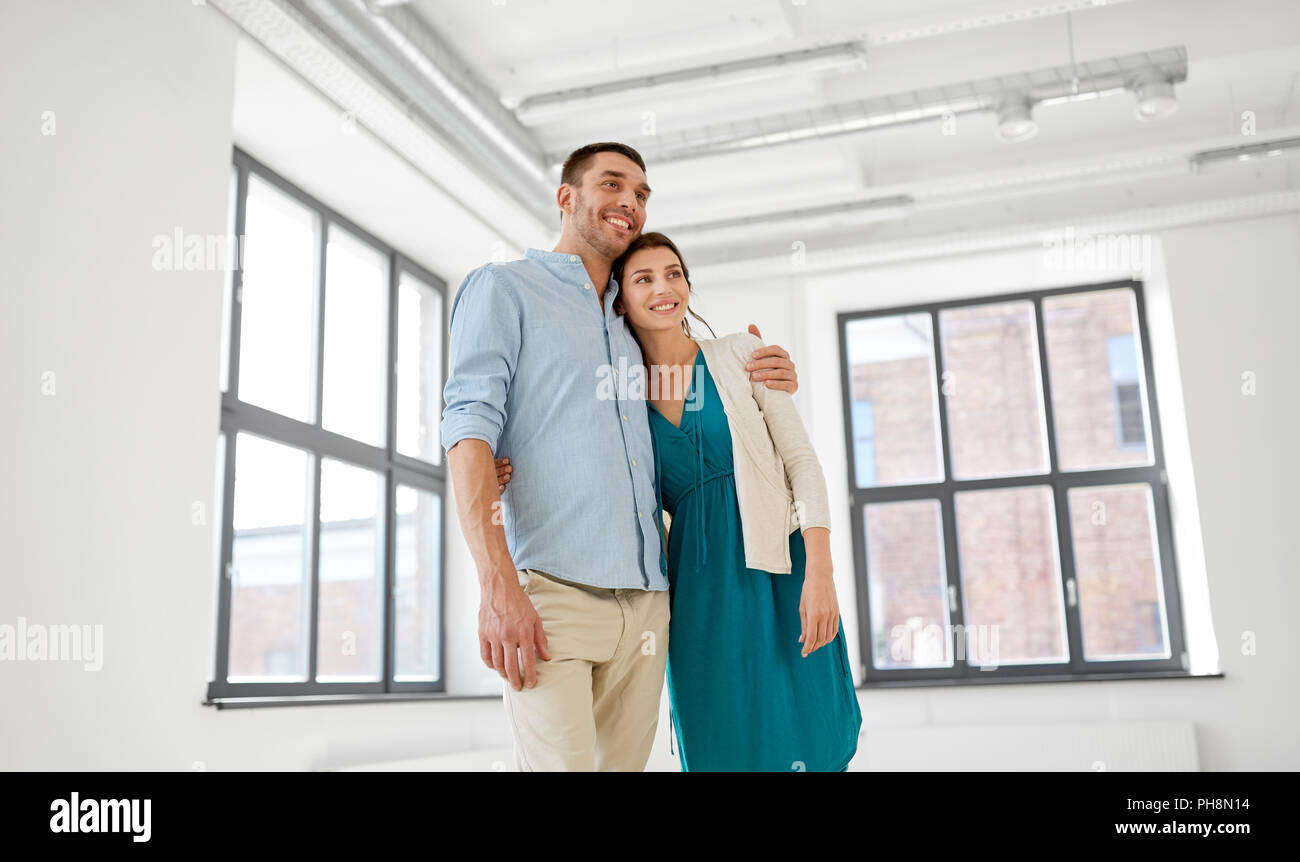 happy couple hugging at new home Stock Photo - Alamy