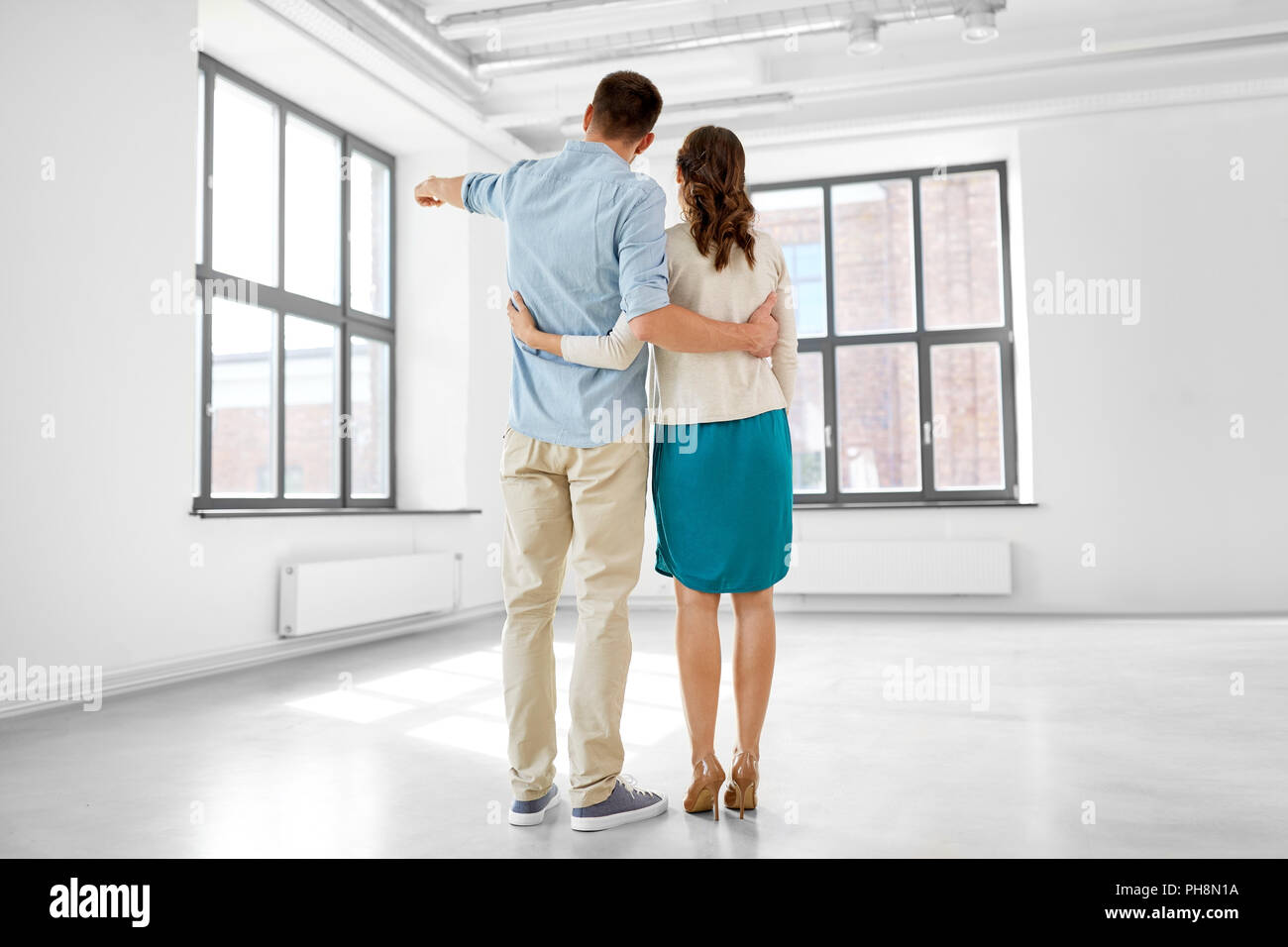 happy couple hugging at new home Stock Photo - Alamy