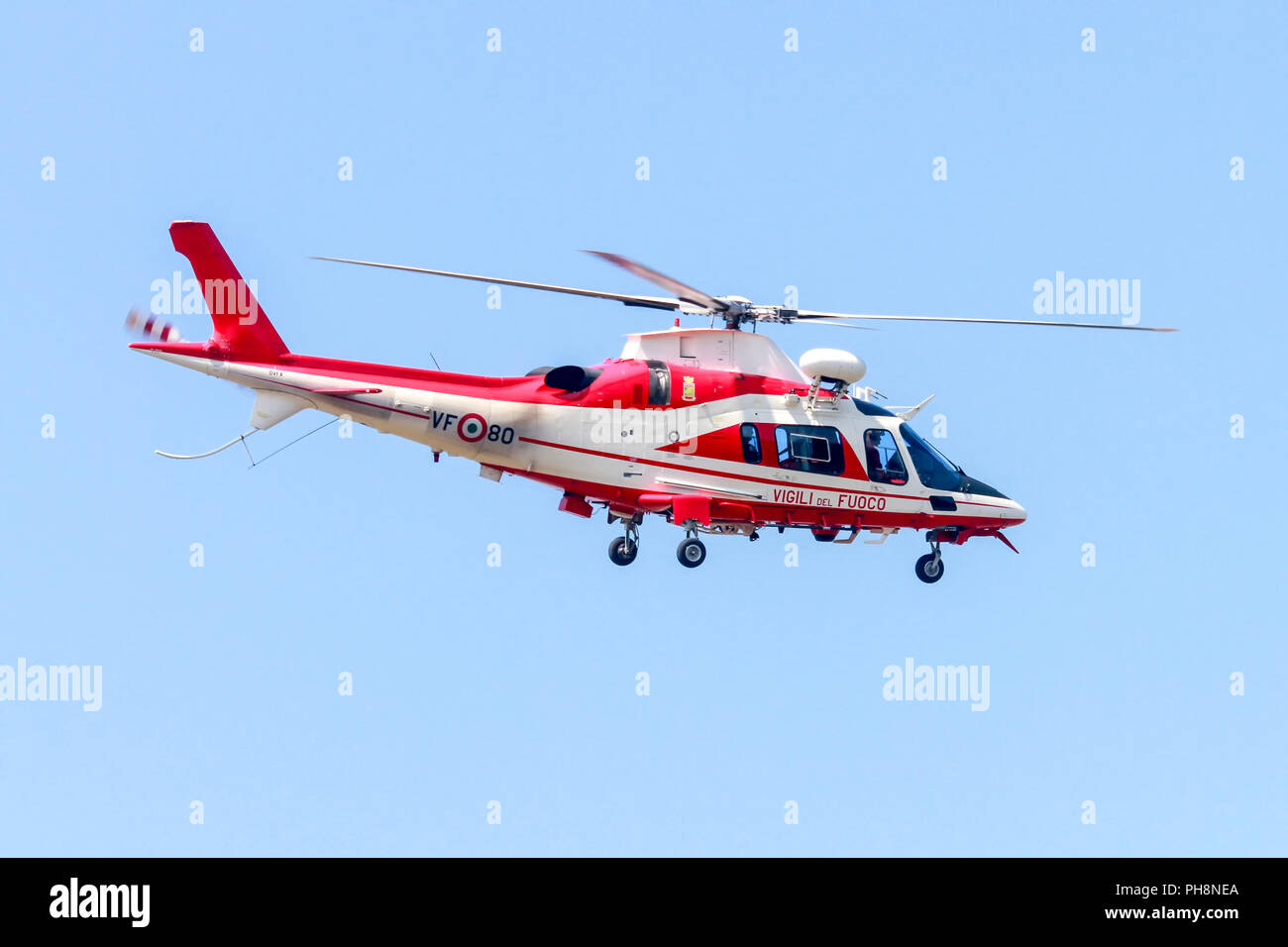 Vigili del Fuoco VF 80 Agusta A109 Power Helicopter on blue sky background Photographed at Malpensa airport, Milan, Italy Stock Photo