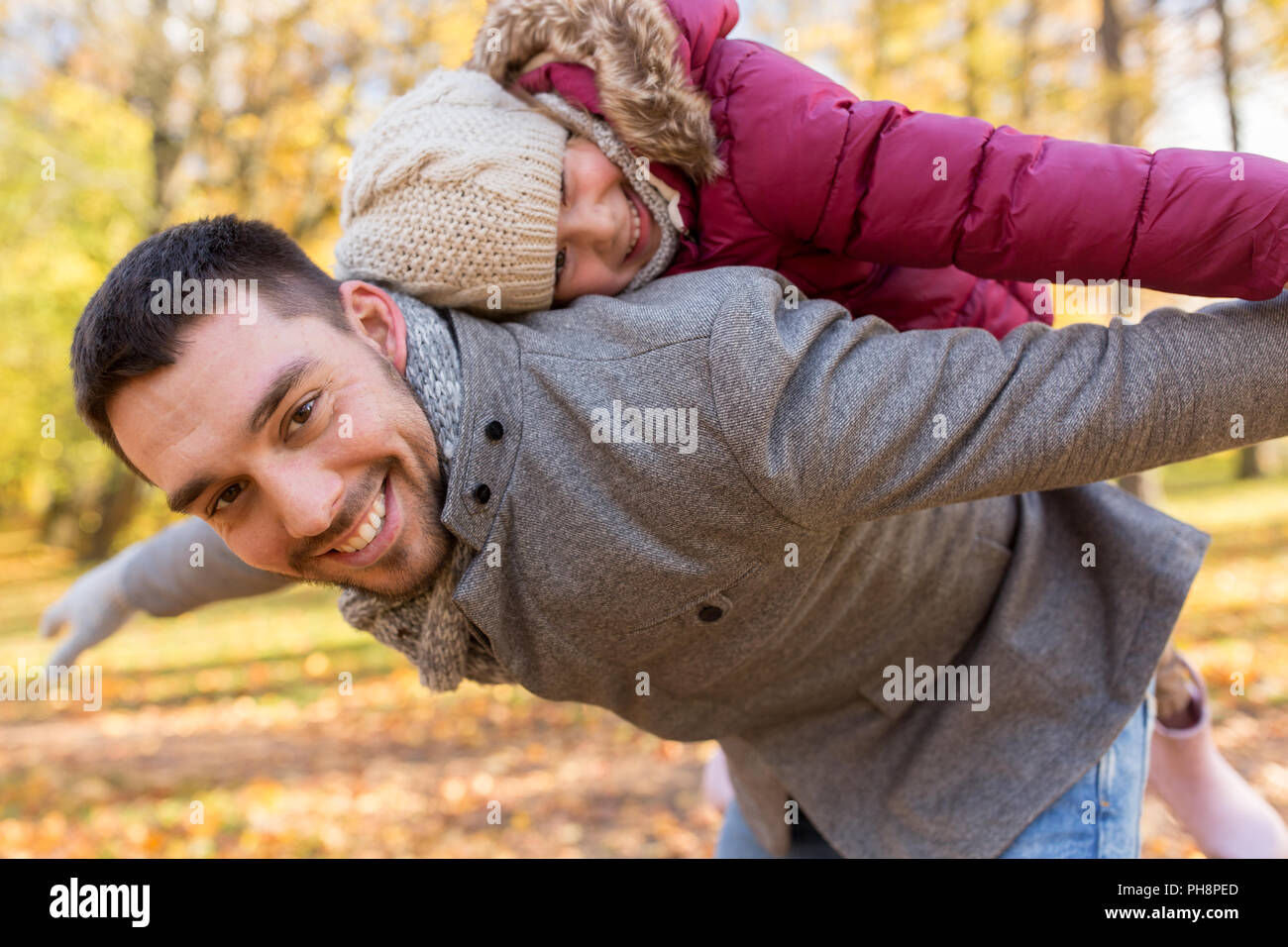 happy father and daughter playing at autumn park Stock Photo - Alamy
