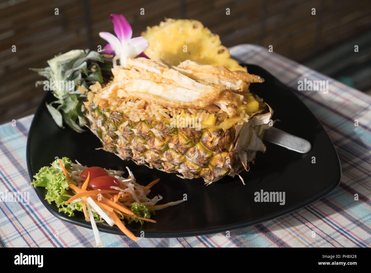 Pineapple fried rice - a traditional dish of Thailand Stock Photo - Alamy