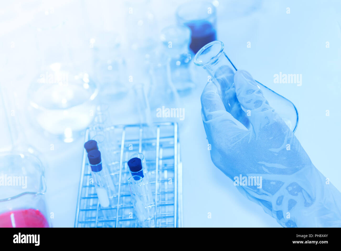 Laboratory glassware containing chemical liquid, science research. Stock Photo