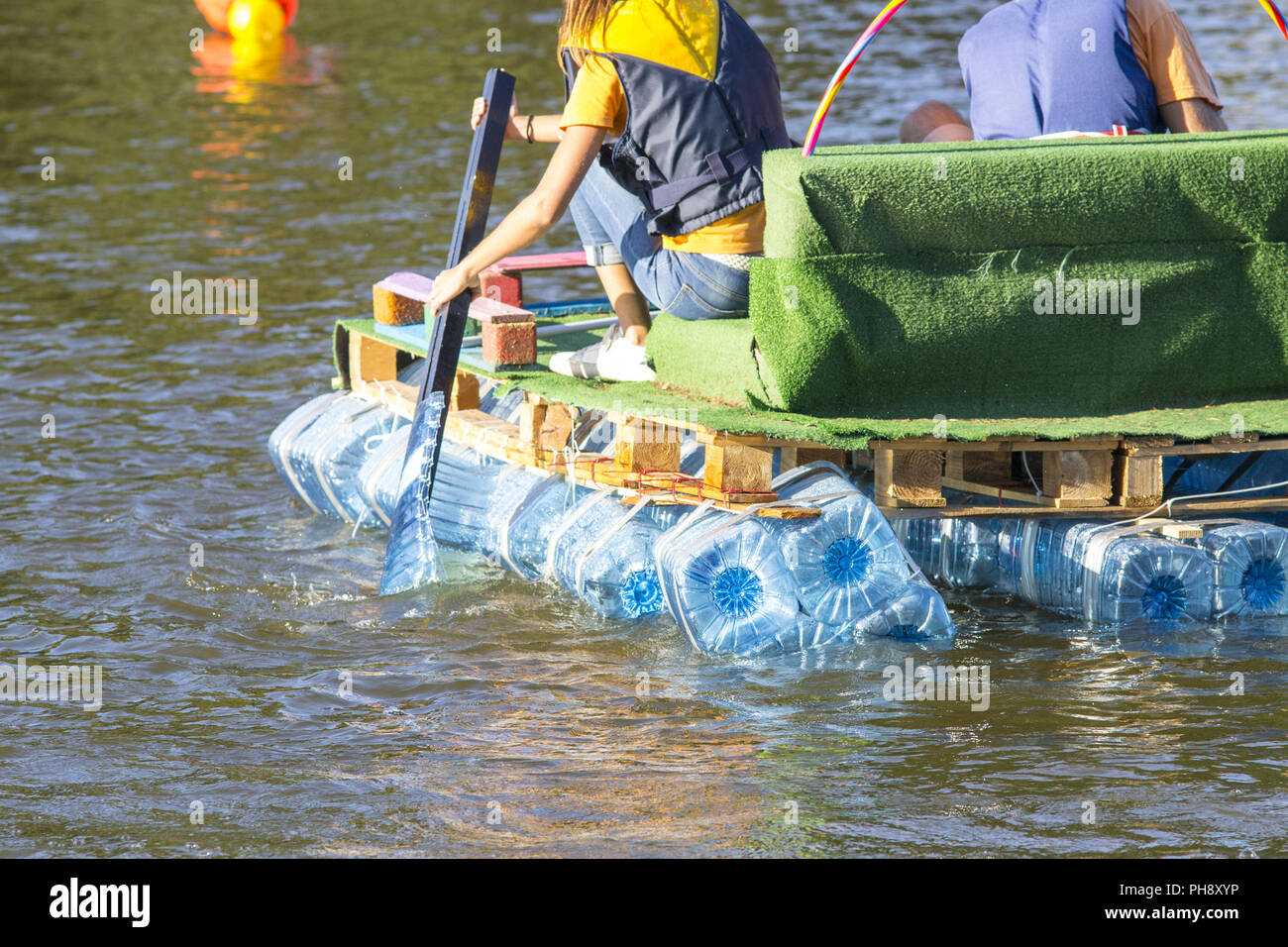 https://c8.alamy.com/comp/PH8XYP/rafts-made-of-recycled-plastic-bottels-to-teach-reuse-PH8XYP.jpg