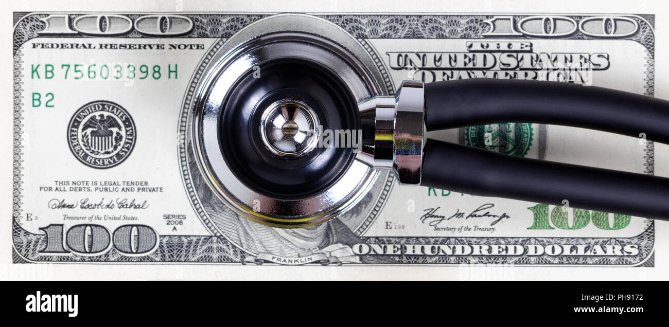 Medical cost concept with stethoscope and paper money Stock Photo