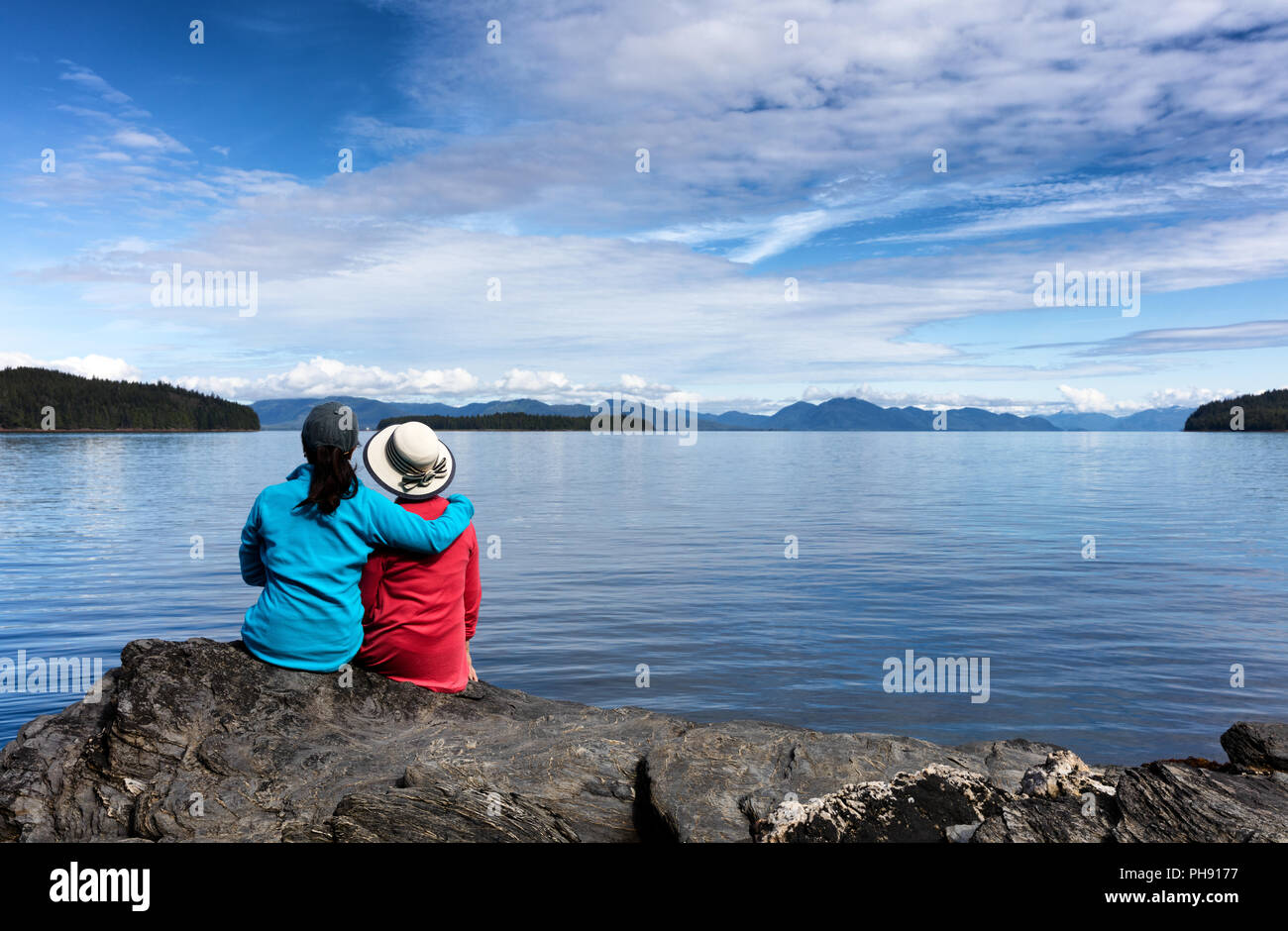 Mother and daughter enjoying nature on the lake Stock Photo