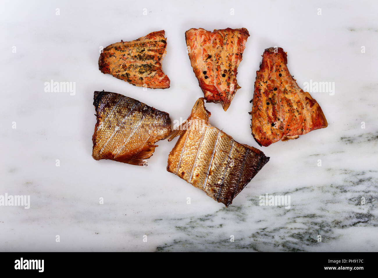 Smoked salmon fillets on marble stone countertop Stock Photo