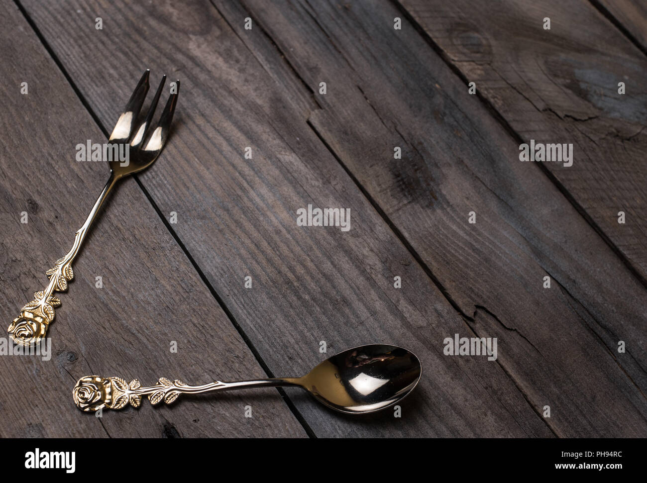 Old fashioned forks on wooden table hires stock photography and images