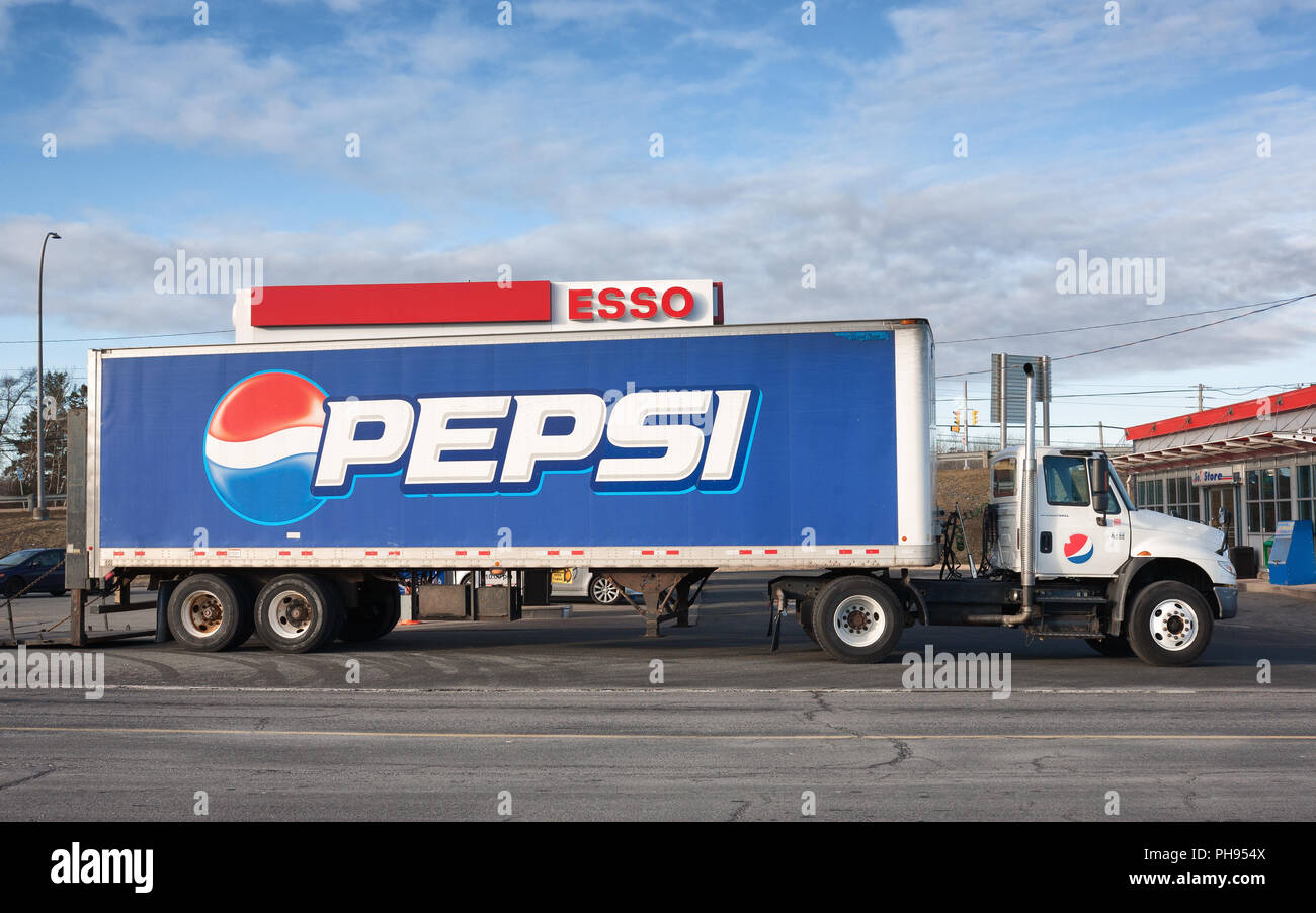 ELMSDALE, CANADA - DECEMBER 06, 2016: Pepsi truck parked at Esso gas station. Pepsi is a worldwide popular soft drink produced by PepsiCo. Stock Photo