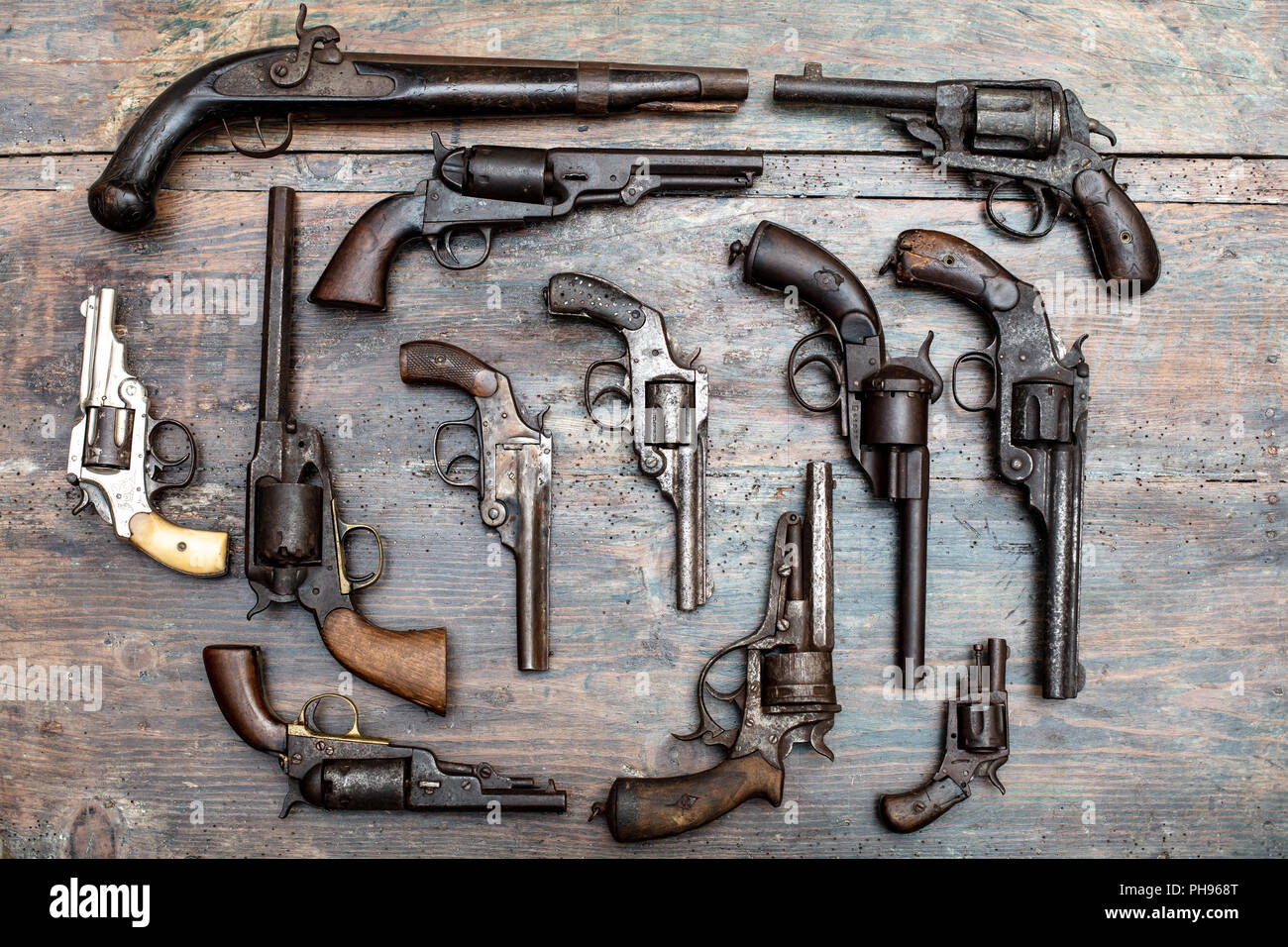 Armory display of historic guns and pistols in a overhead view on a