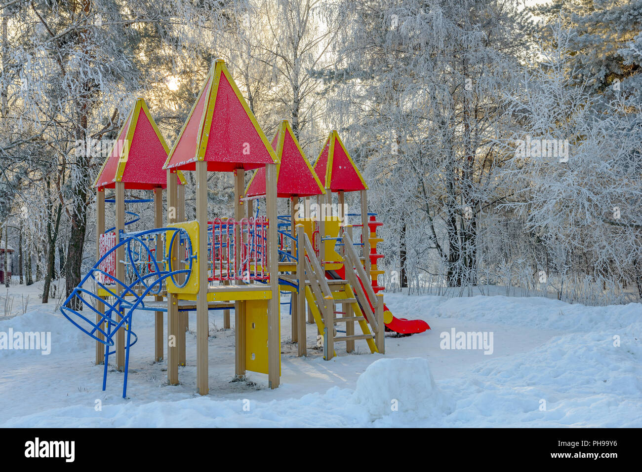 Playground in winter park Stock Photo