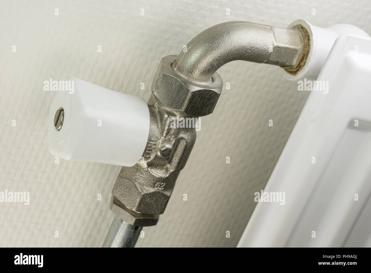 White radiator button on a heating element Stock Photo Alamy