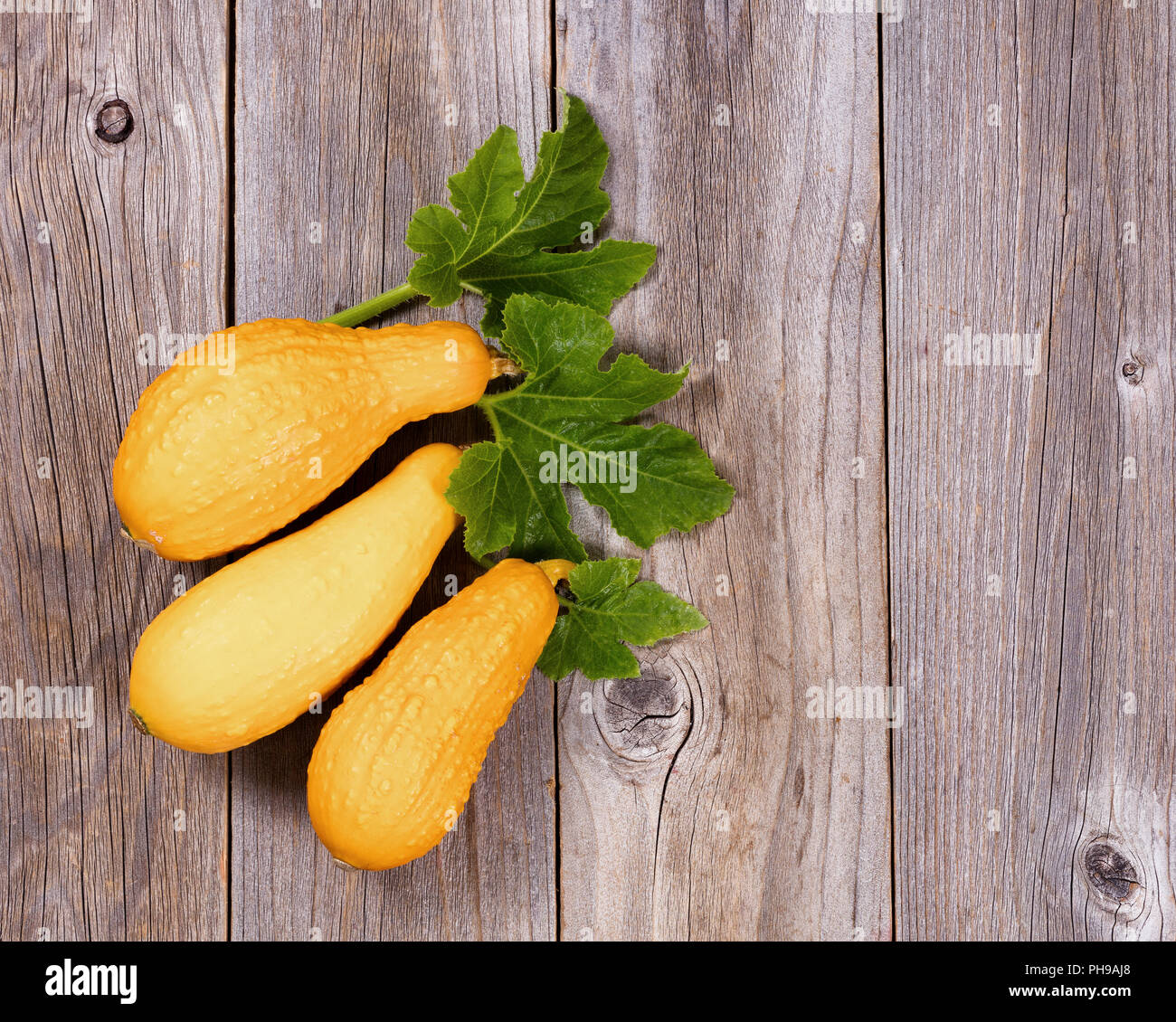 Seasonal autumn squash vegetables on rustic wooden boards Stock Photo
