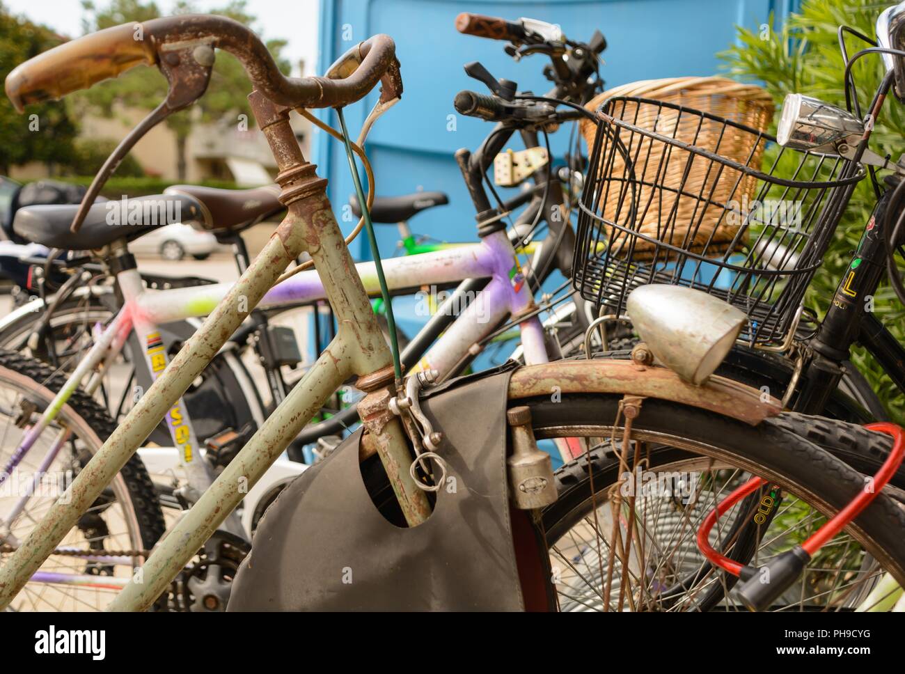Nostalgic rusty bicycle locked for safety - close-up Stock Photo
