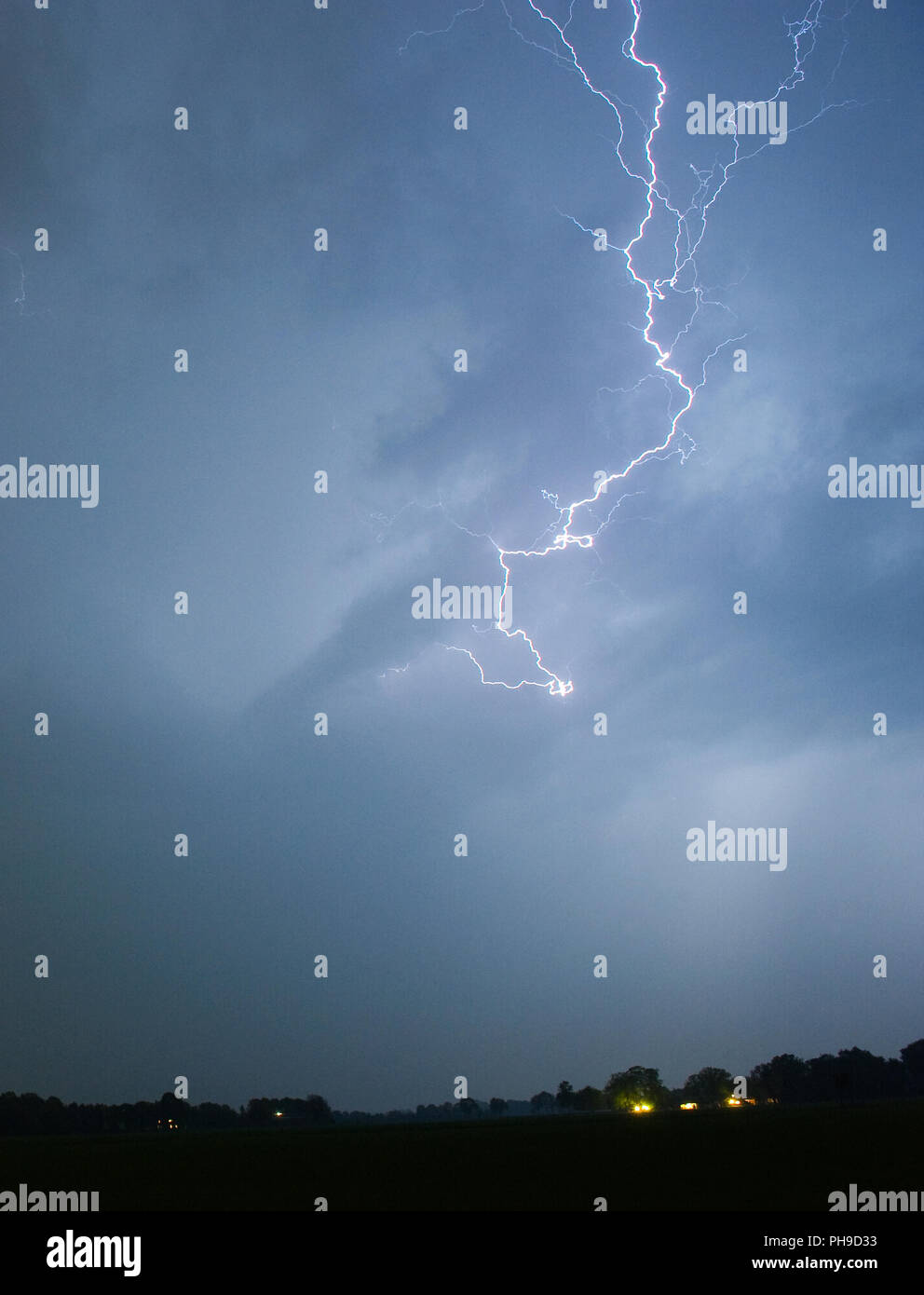 Lightning during a thunderstorm in the Netherlands Stock Photo - Alamy