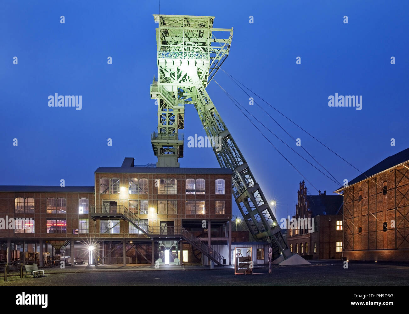 illuminated shaft tower of coal pit Zollern in the twilight, Dortmund, Ruhr Area, Germany, Europe Stock Photo