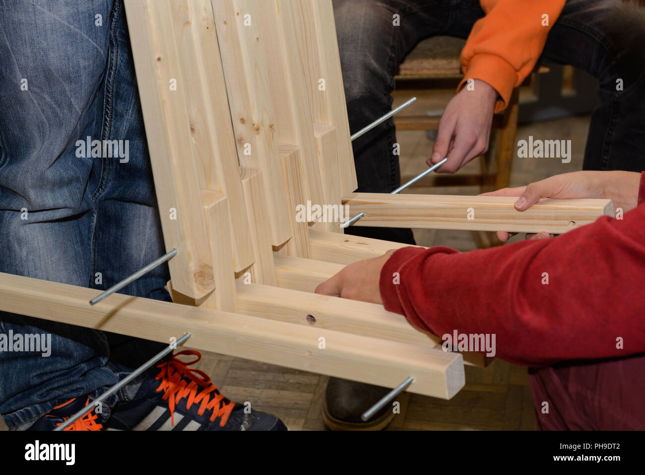 Carpentry building rustic wooden armchairs - close up wooden connections Stock Photo
