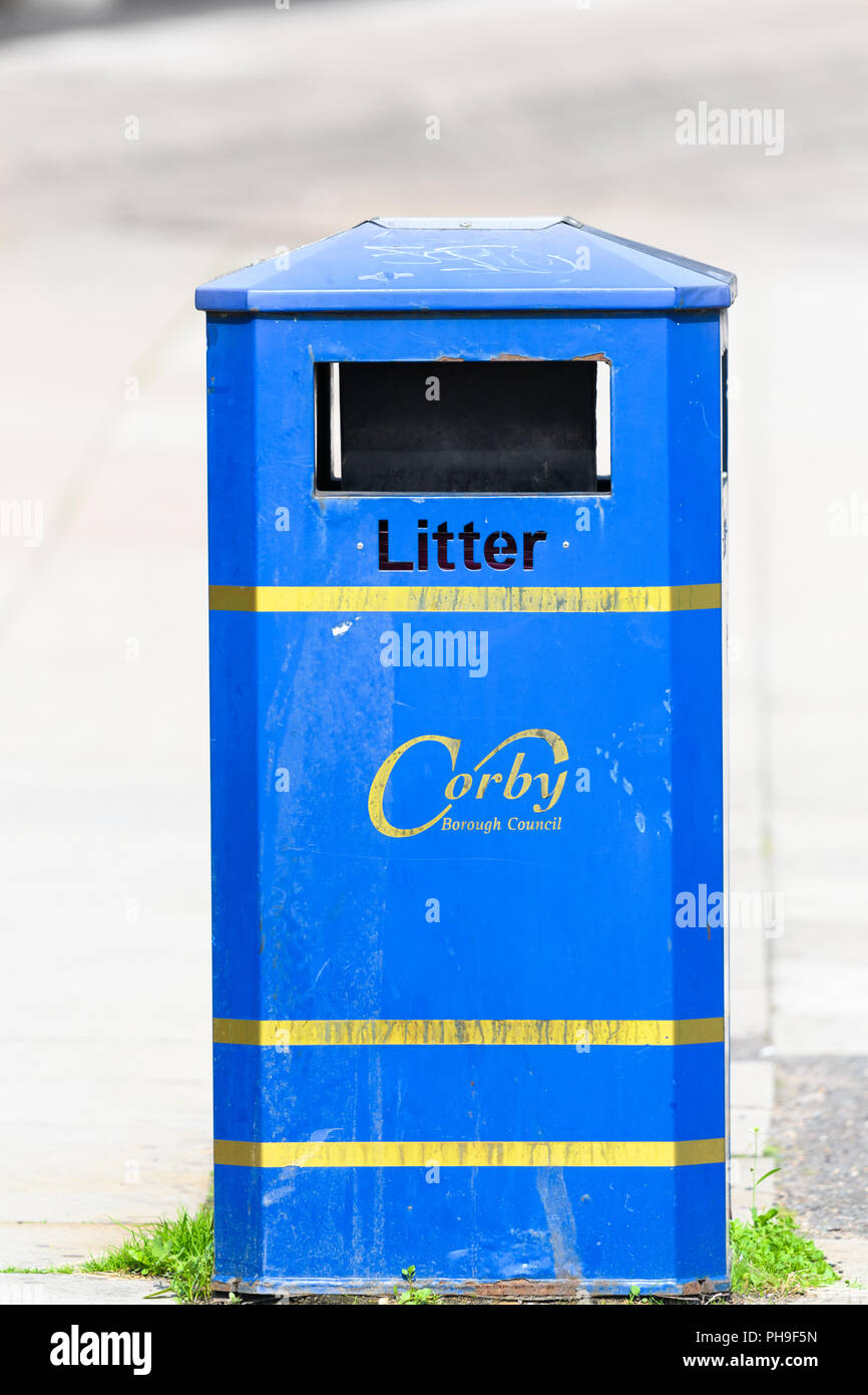 Blue litter bin at the town centre of Corby, East Midlands, England. Stock Photo