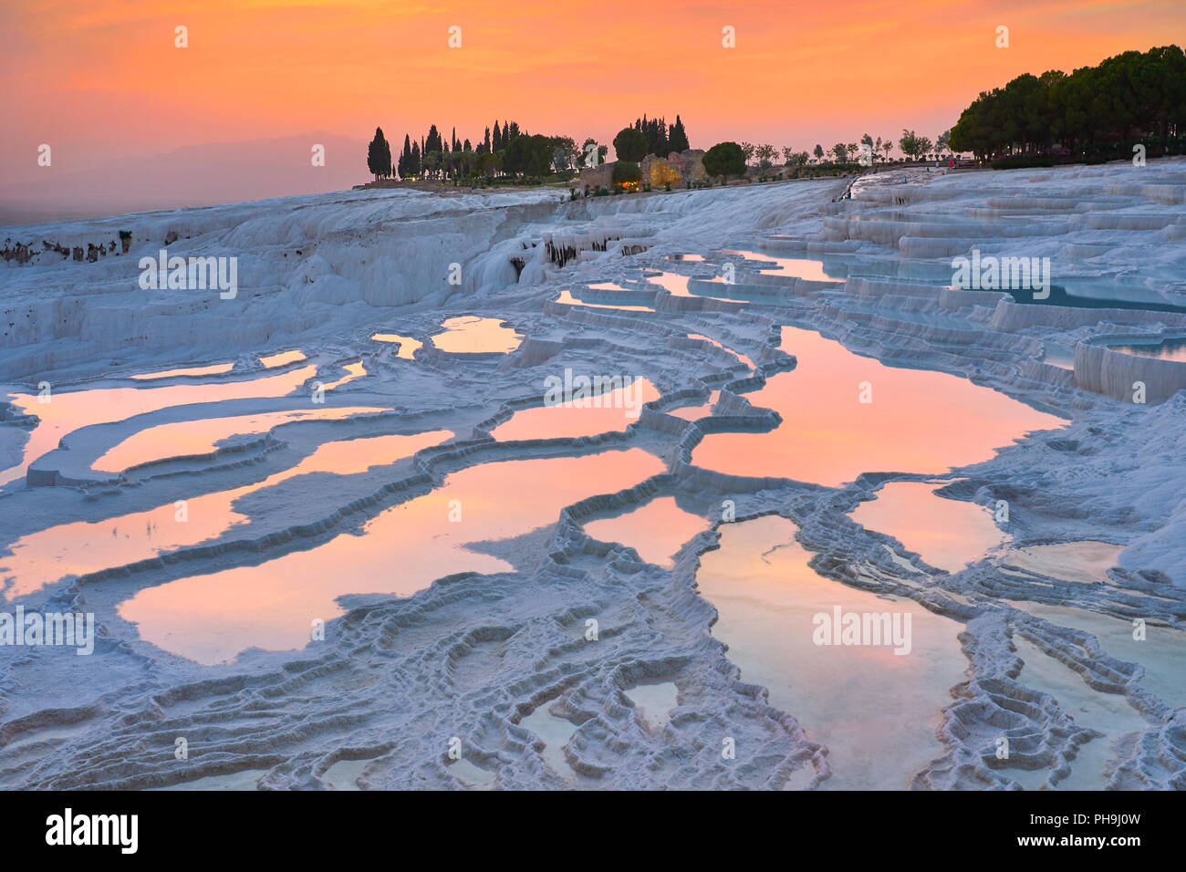 Pamukkale Limestone Terraces At Sunset Time Pamukkale Turkey Stock pamukkale-limestone-terraces-at-sunset-time-pamukkale-turkey-stock