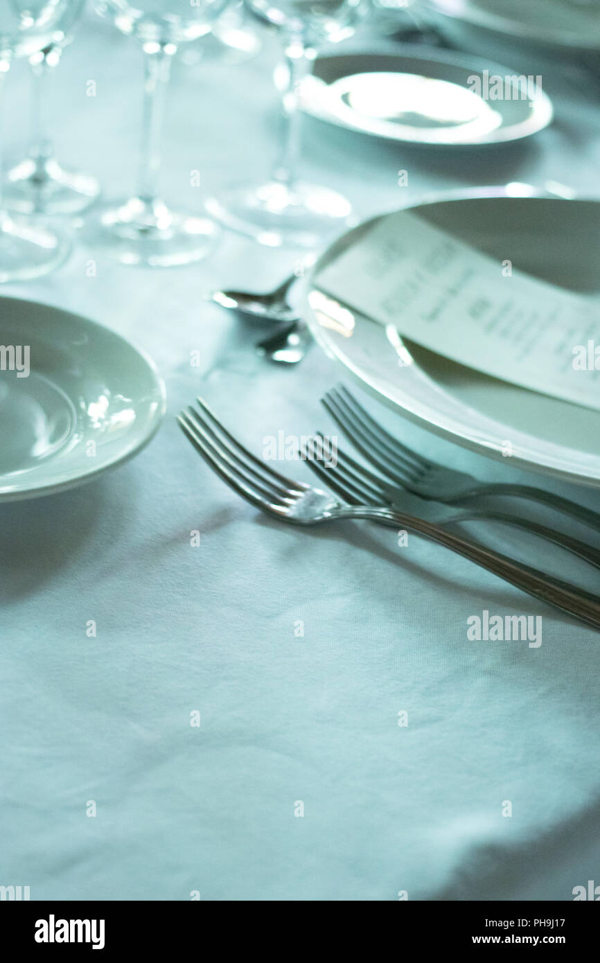 Wedding reception banquet dinner party table place settings set in