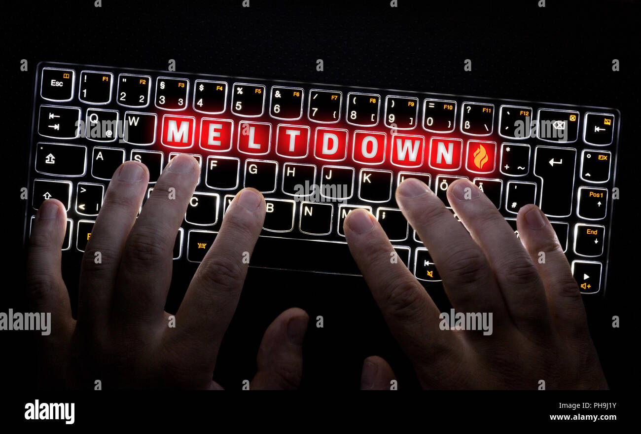 Meltdown Virus keyboard is operated by Hacker. Stock Photo