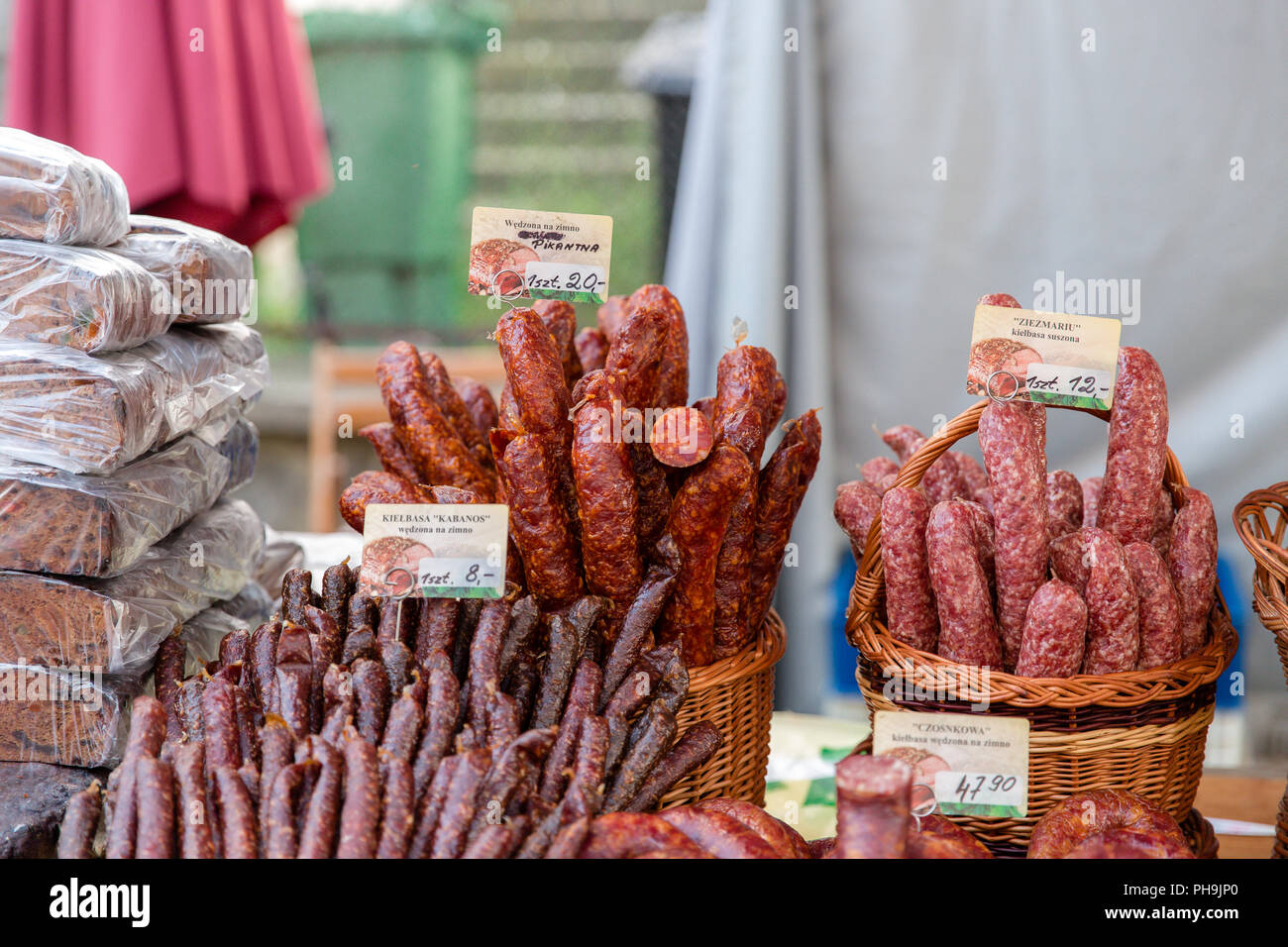 Market stall with traditional Lithuanian smoked and dried sausages at the street market in Krosno, Poland Stock Photo