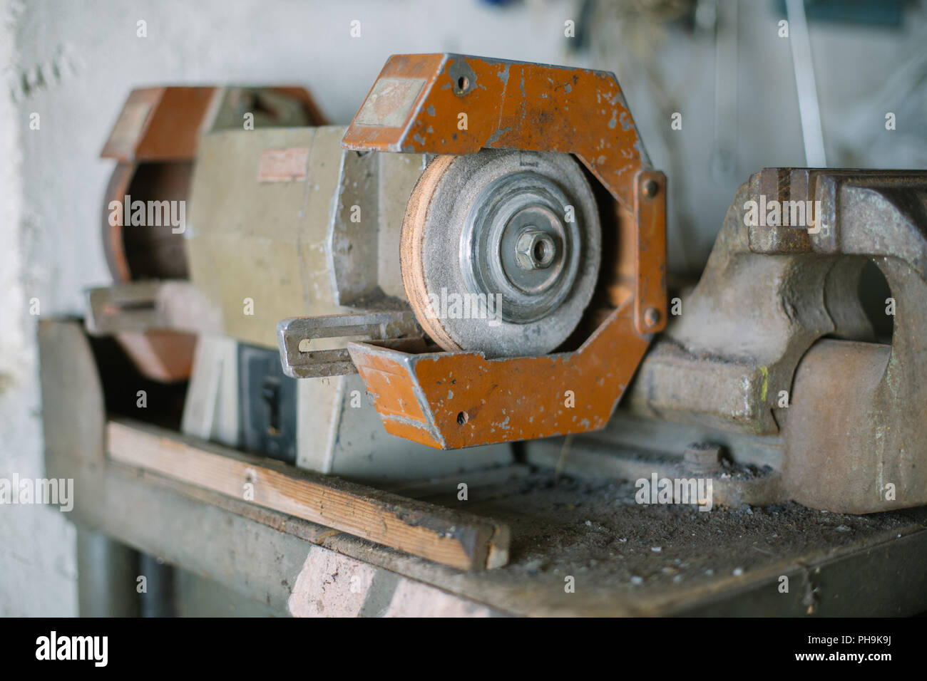 Old heavy duty bench grinder machine Stock Photo