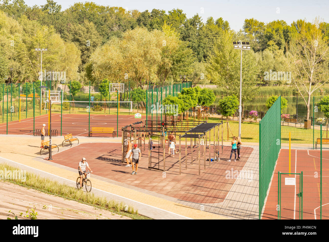 Kiev/Ukraine - August 23, 2018 -  Outdoor sports facility in the Natalka park of Kiev in Ukraine, close to the Dnieper river. People are training unde Stock Photo