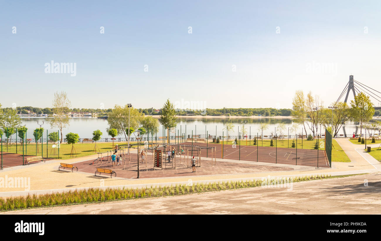 Kiev/Ukraine - August 23, 2018 -  Outdoor sports facility in the Natalka park of Kiev in Ukraine, close to the Dnieper river. People are training unde Stock Photo