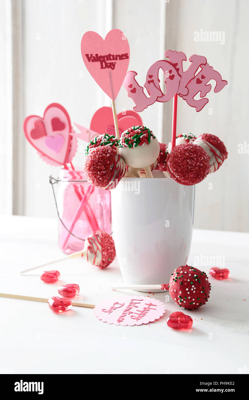 Closeup Of Cake Pops With Decorations On Kitchen Table Stock Photo