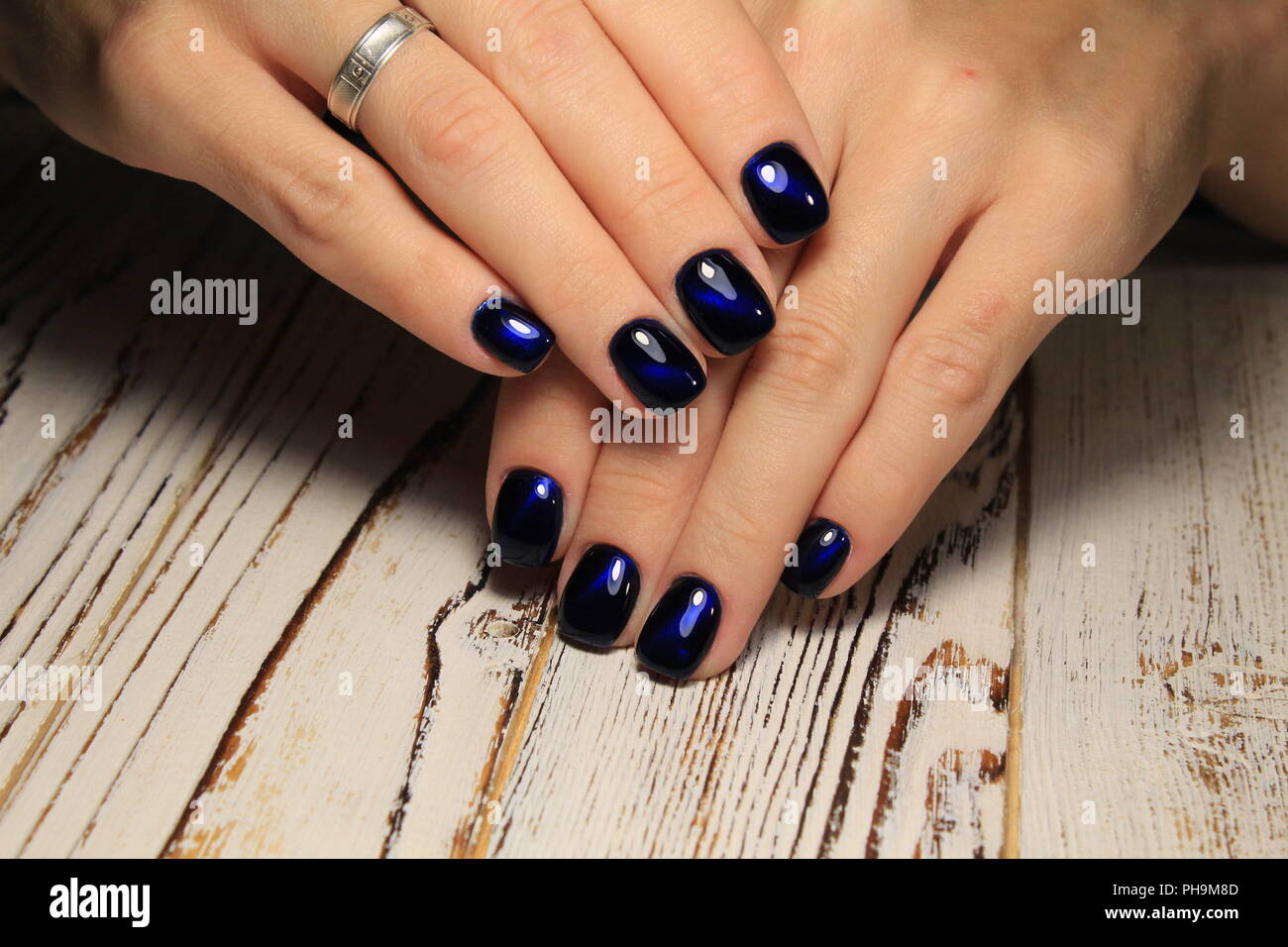 Closeup of woman hands with nail design. Trendy crackle nail polish.  Manicure and nail tattoo trend. Closeup of woman hands on black background.  Fashi Stock Photo - Alamy