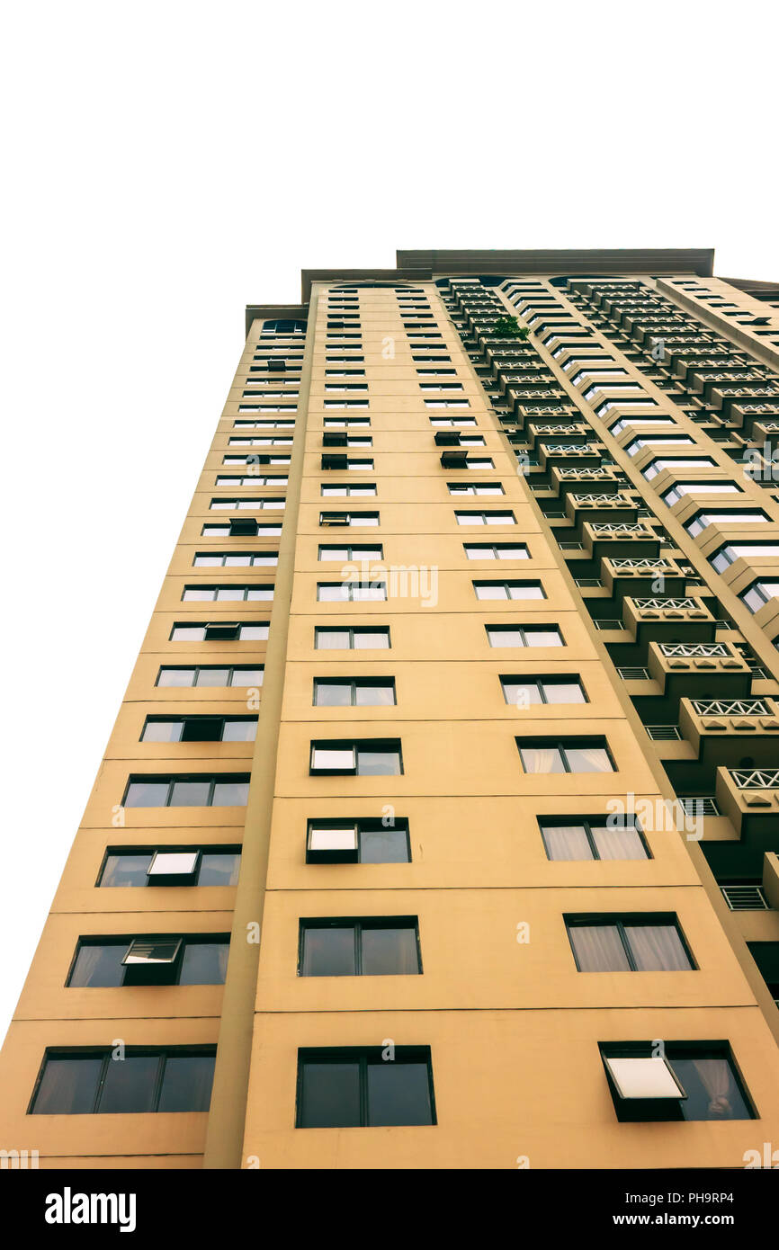Apartment building that has many windows when looks from below. The building has around 25