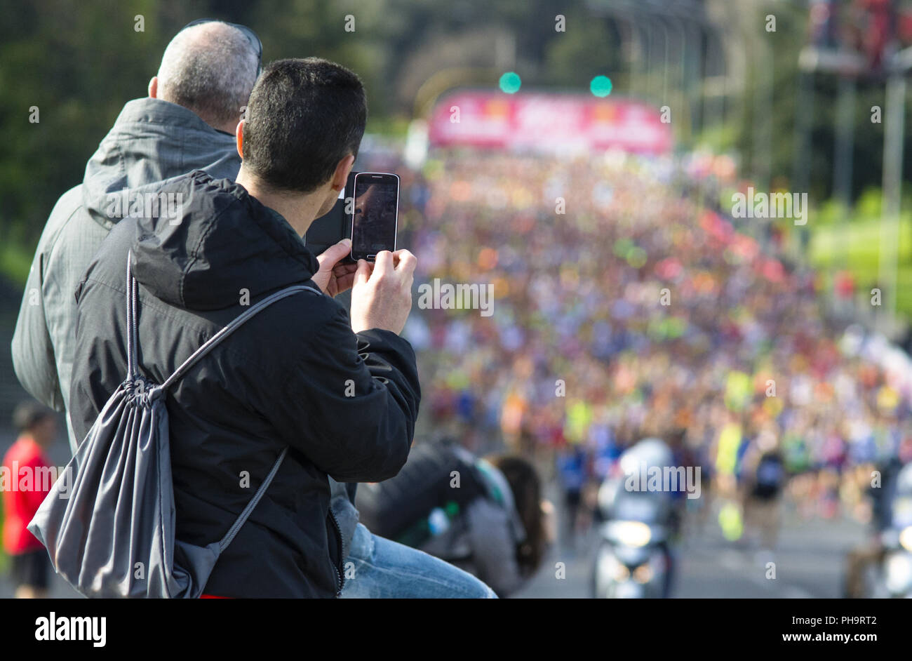 photographer taking picture of a marathon Stock Photo