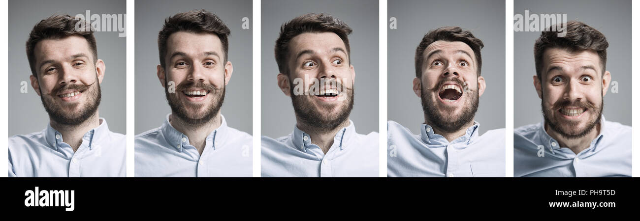 Set of young man's portraits with different happy emotions on gray studio background Stock Photo