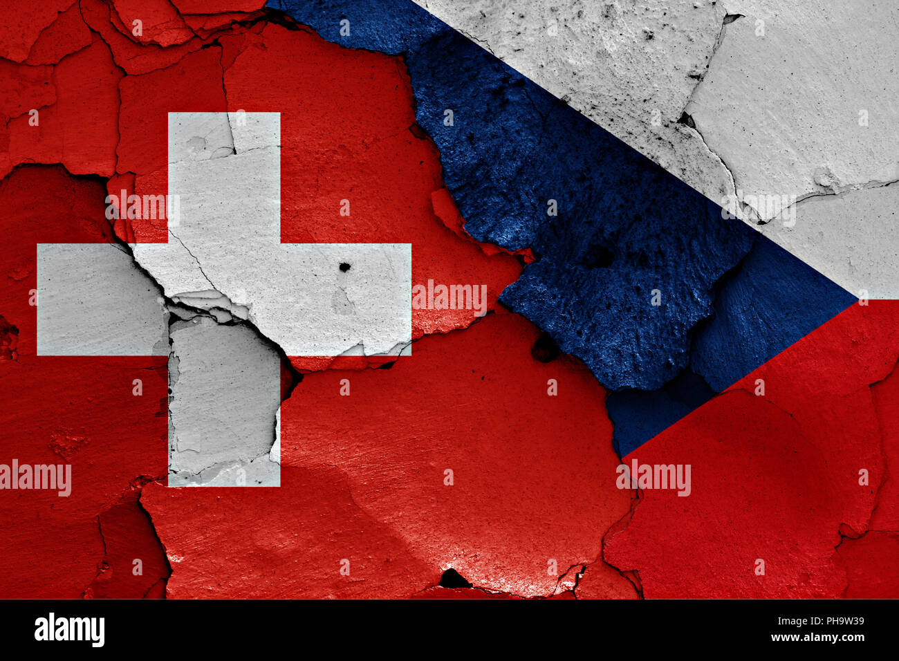 flags of Switzerland and Czechia painted on cracked wall Stock Photo