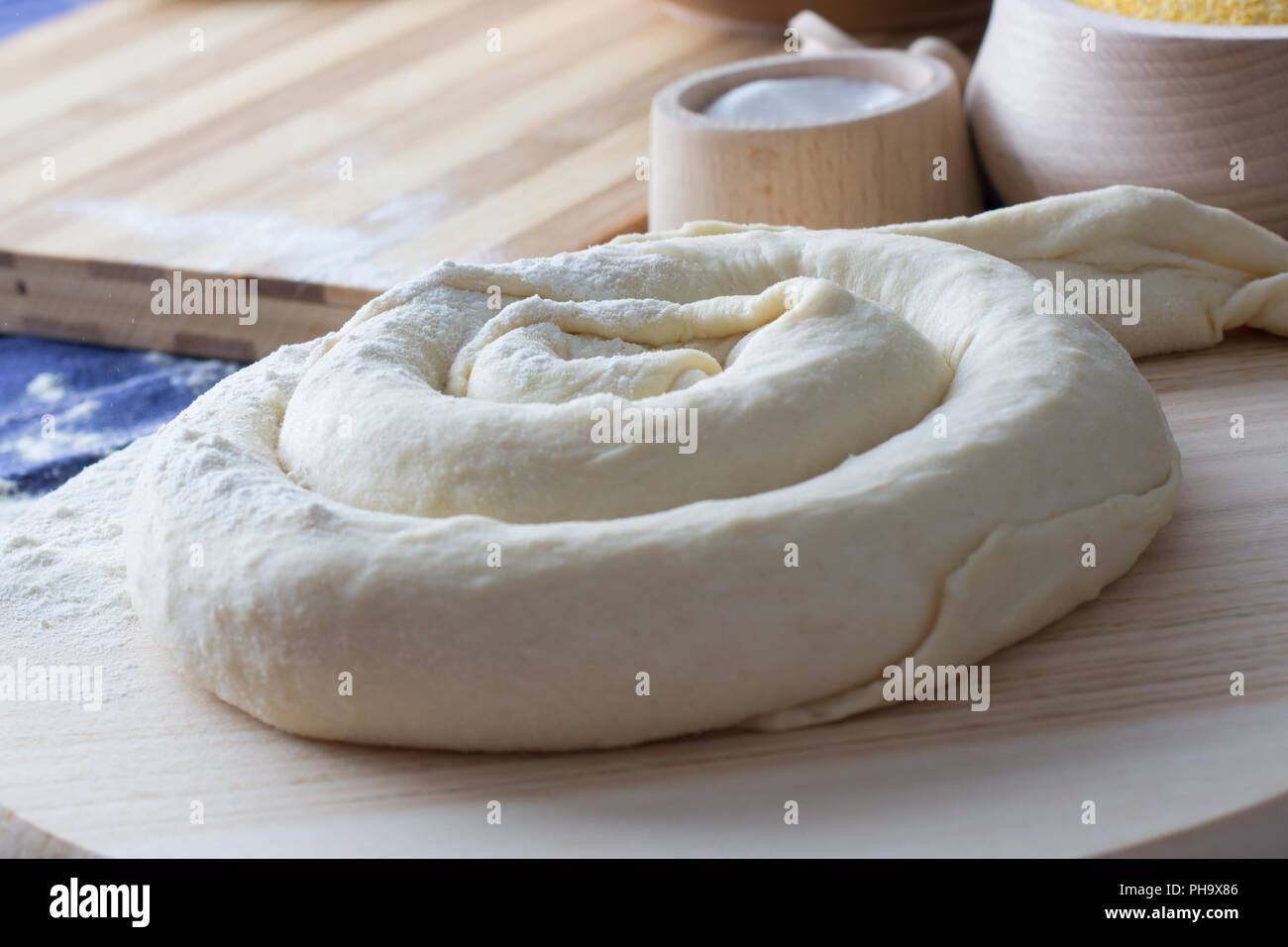 Cheese pie  on the wooden plate ready for baking Stock Photo