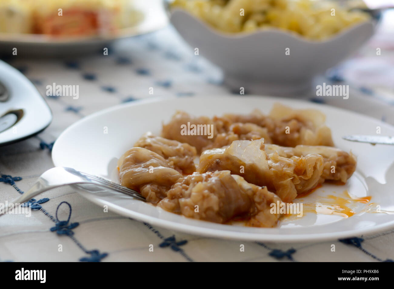 Serbian specialty sarma in the white plate chopped Stock Photo