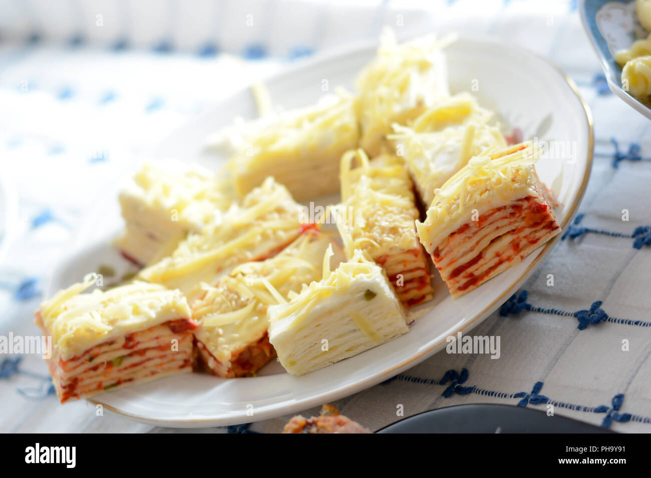 Close up of served salt cake with yellow cheese Stock Photo