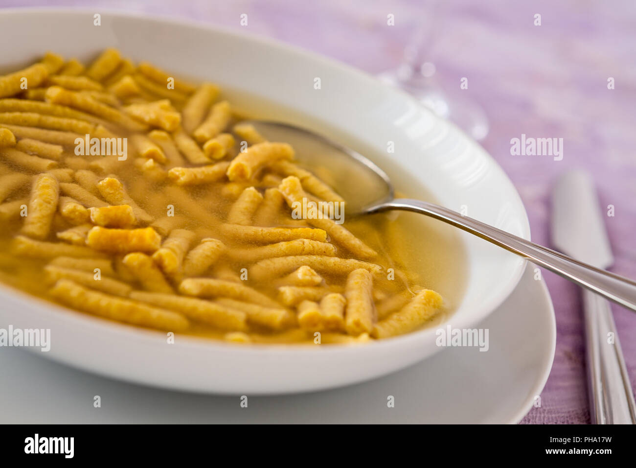 Closeup of Passatelli in broth original Italian pasta Stock Photo Alamy
